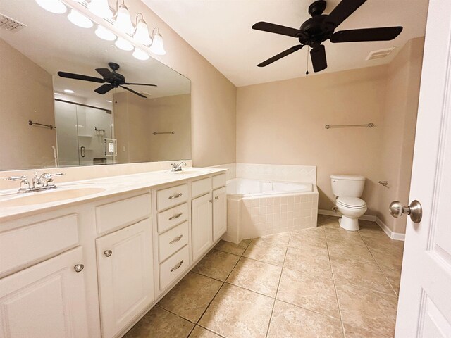 9321 Royal Troon Dr, Tallahassee, FL 32312 - bathroom with a ceiling fan, toilet, a garden tub, and a stall shower