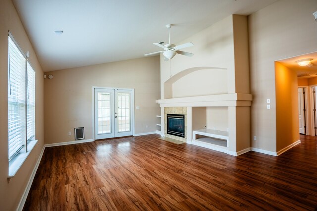 9321 Royal Troon Dr, Tallahassee, FL 32312 - unfurnished living room with high vaulted ceiling, wood finished floors, ceiling fan, and baseboards