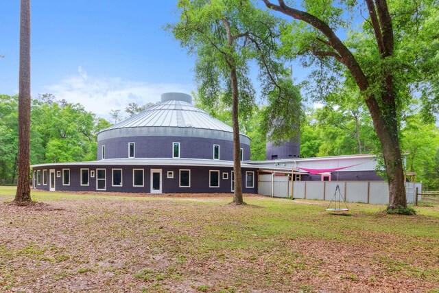 rear view of house with a lawn