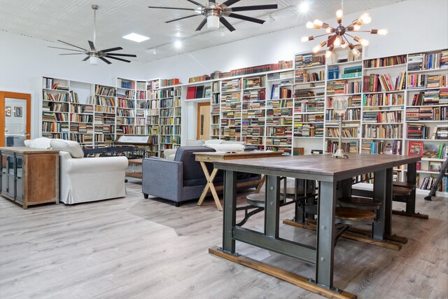 dining space with wood-type flooring