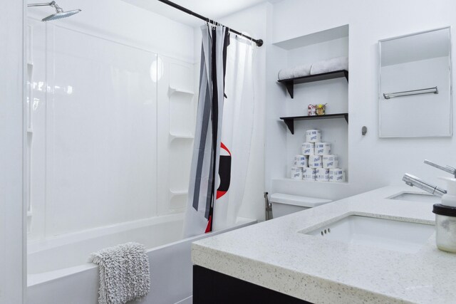 full bathroom featuring vanity, shower / bath combo, and toilet