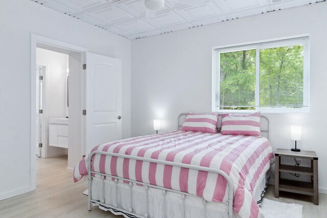 bedroom with light hardwood / wood-style floors