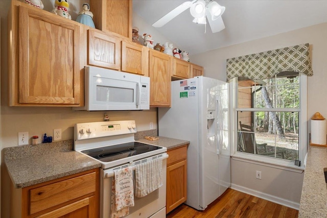 kitchen with light wood-type flooring, baseboards, ceiling fan, and white appliances