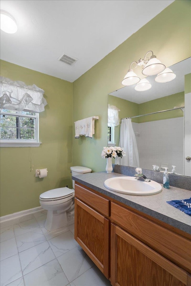 full bath with vanity, toilet, baseboards, marble finish floor, and visible vents