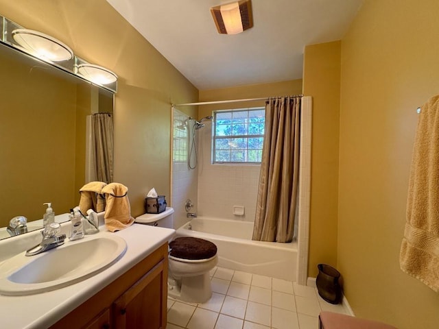 bathroom featuring tile patterned floors, shower / bath combo, toilet, vanity, and lofted ceiling