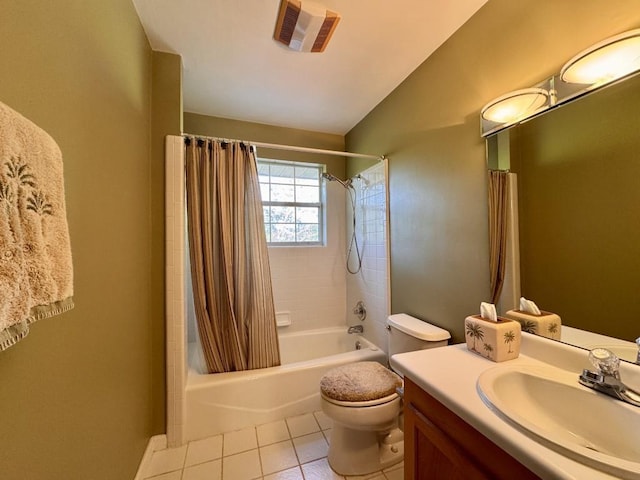 full bath featuring shower / bath combo, vanity, tile patterned floors, toilet, and vaulted ceiling