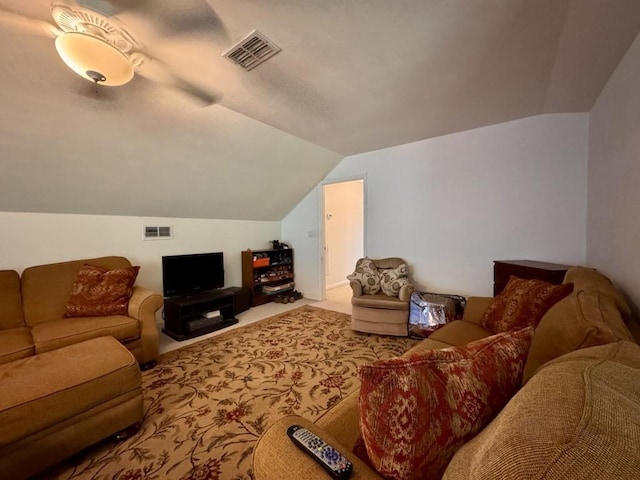 living room featuring carpet, visible vents, and vaulted ceiling