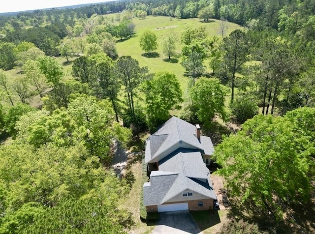 bird's eye view featuring a forest view