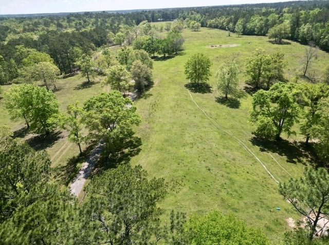 drone / aerial view with a rural view and a view of trees