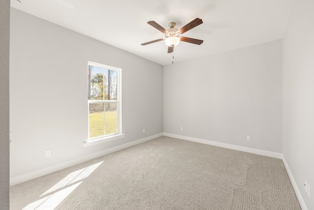 unfurnished room featuring carpet floors and ceiling fan