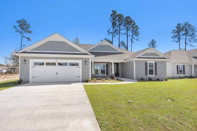 ranch-style house featuring a front yard and a garage