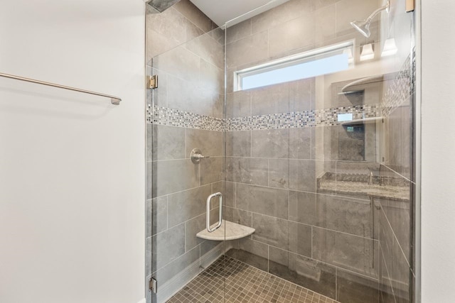 bathroom featuring a shower with shower door