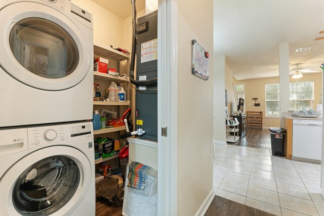3400 Old Bainbridge Rd Unit 108, Tallahassee, FL 32303 - laundry area featuring visible vents, light tile patterned floors, laundry area, stacked washer / drying machine, and a ceiling fan
