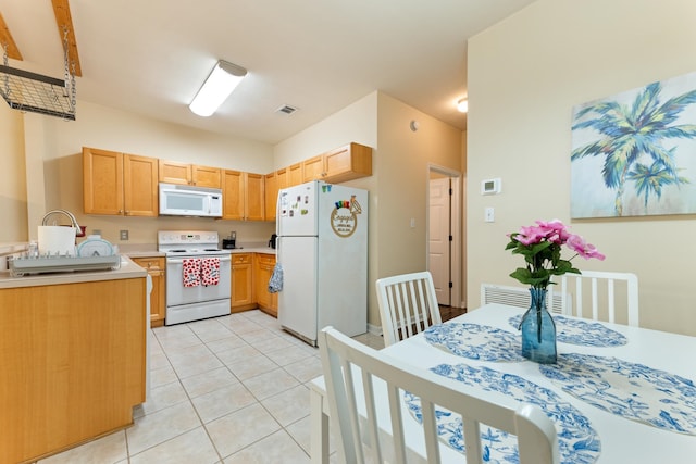 3400 Old Bainbridge Rd Unit 108, Tallahassee, FL 32303 - kitchen with visible vents, white appliances, light tile patterned flooring, and light countertops