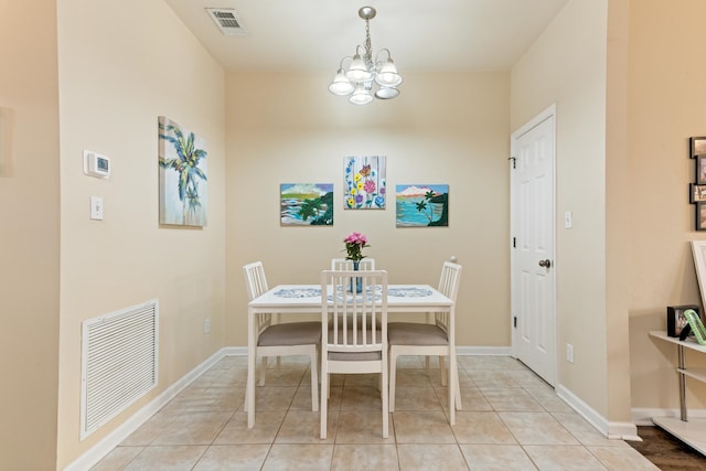 3400 Old Bainbridge Rd Unit 108, Tallahassee, FL 32303 - unfurnished dining area with visible vents, baseboards, a notable chandelier, and light tile patterned flooring