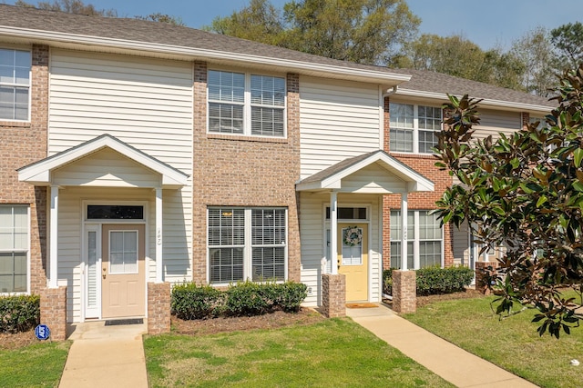 3400 Old Bainbridge Rd Unit 108, Tallahassee, FL 32303 - view of property featuring a front lawn and brick siding