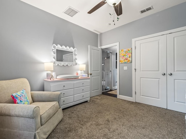 living area featuring ceiling fan and dark carpet