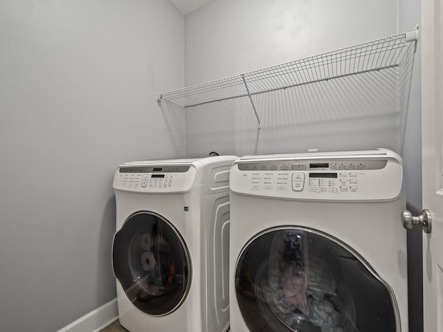 washroom with independent washer and dryer