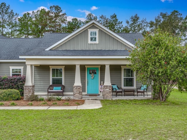 craftsman-style house with a front lawn and a porch