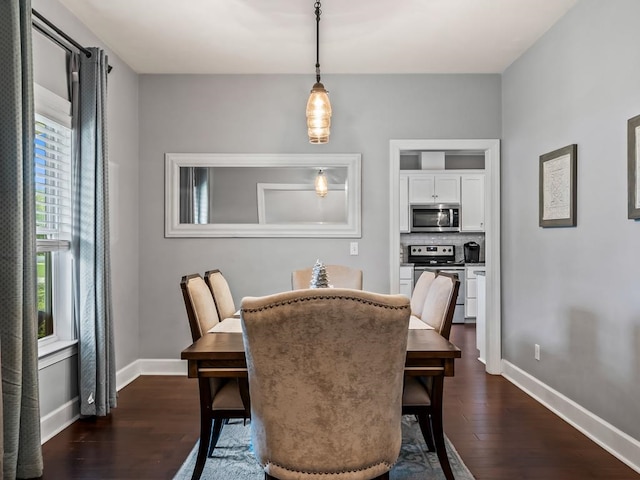 dining room with dark hardwood / wood-style flooring