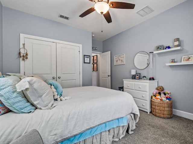 carpeted bedroom with a closet and ceiling fan