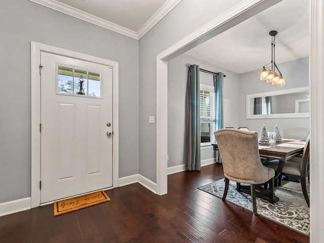 foyer featuring dark hardwood / wood-style flooring, crown molding, and a healthy amount of sunlight