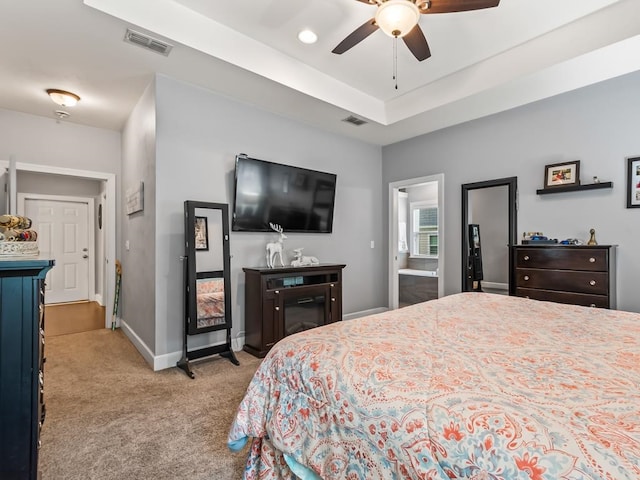 bedroom with ceiling fan and light colored carpet