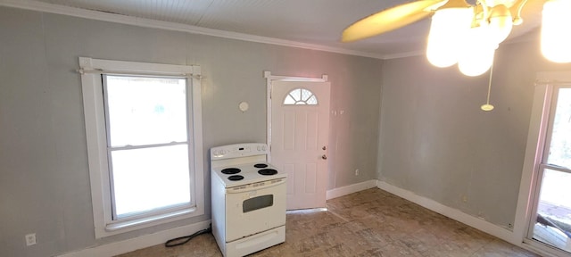 kitchen featuring crown molding, electric range, and baseboards