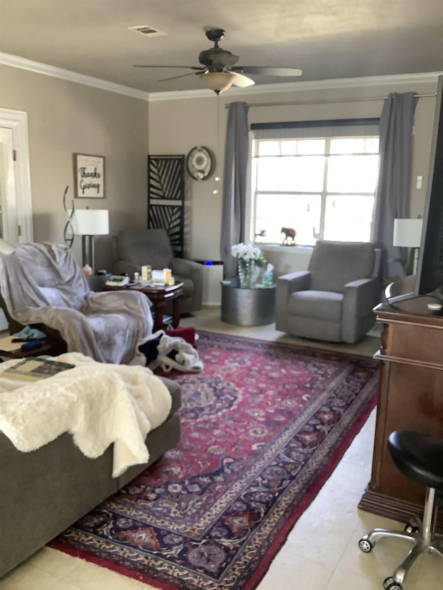 living room featuring visible vents, a ceiling fan, and crown molding