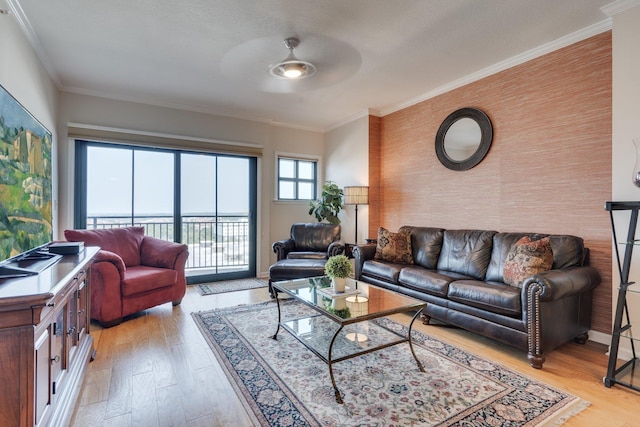 121 N Monroe St Unit 1103, Tallahassee, FL 32301 - living area with ceiling fan, an accent wall, light wood-style flooring, and ornamental molding