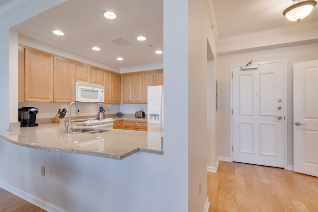 121 N Monroe St Unit 1103, Tallahassee, FL 32301 - kitchen with white appliances, light brown cabinetry, crown molding, light wood finished floors, and light stone counters