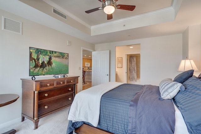 121 N Monroe St Unit 1103, Tallahassee, FL 32301 - bedroom with ornamental molding, a tray ceiling, light colored carpet, ceiling fan, and baseboards