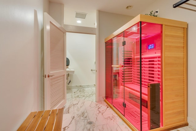 121 N Monroe St Unit 1103, Tallahassee, FL 32301 - bathroom featuring a sauna, marble look tiles, and recessed lighting