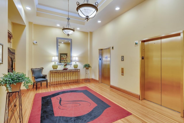121 N Monroe St Unit 1103, Tallahassee, FL 32301 - foyer featuring elevator, wood finished floors, baseboards, recessed lighting, and a towering ceiling