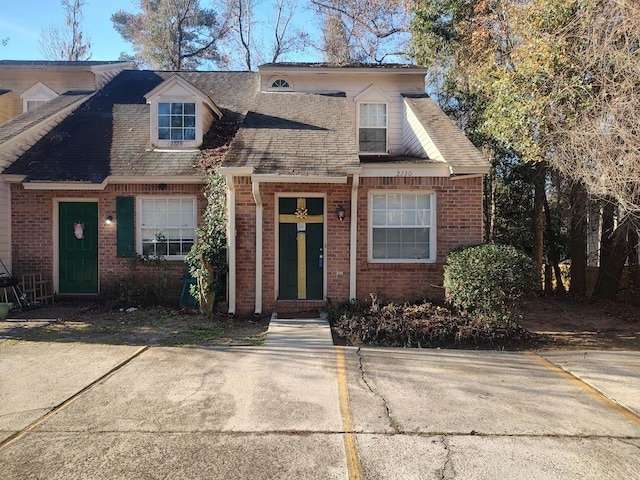 2230 Parrot Ln, Tallahassee, FL 32303 - cape cod house featuring brick siding and roof with shingles