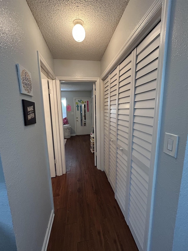 2230 Parrot Ln, Tallahassee, FL 32303 - hall featuring dark wood-style flooring and a textured ceiling