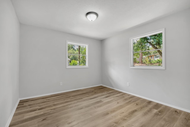319 Meadowbrook Ln, Tallahassee, FL 32304 - spare room featuring baseboards and light wood-style flooring
