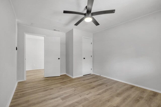 319 Meadowbrook Ln, Tallahassee, FL 32304 - unfurnished room featuring ceiling fan, baseboards, and light wood-type flooring