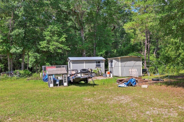 147 Hawk Ridge Dr, Havana, FL 32333 - view of green lawn featuring a shed