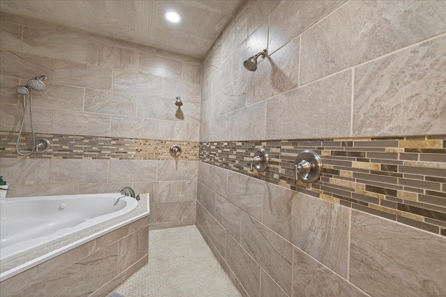 147 Hawk Ridge Dr, Havana, FL 32333 - bathroom featuring a tile shower, a relaxing tiled tub, recessed lighting, and tile walls