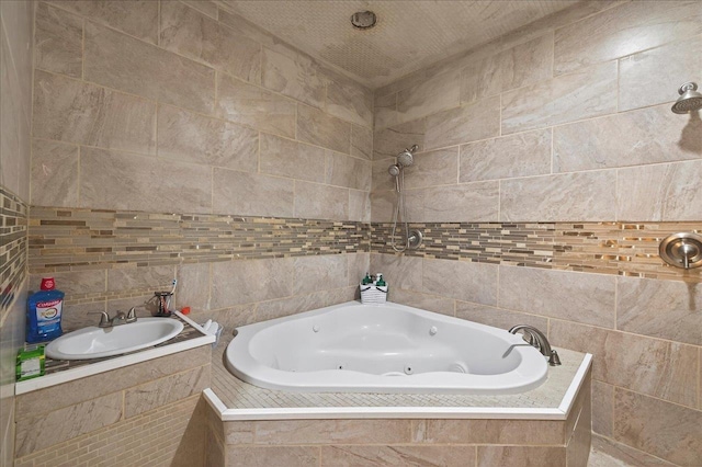 147 Hawk Ridge Dr, Havana, FL 32333 - bathroom with a whirlpool tub and tile walls