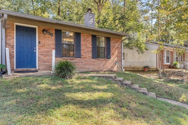 single story home with a front yard