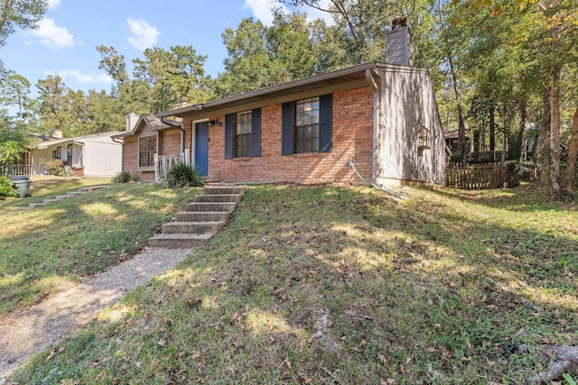 single story home featuring a front yard