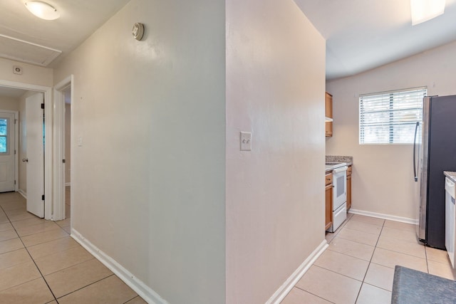 corridor with light tile patterned flooring