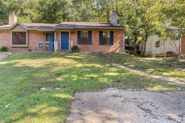 ranch-style house with a front lawn