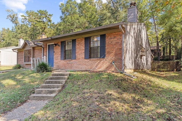 single story home featuring a front yard