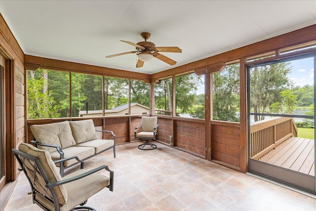 sunroom / solarium with ceiling fan