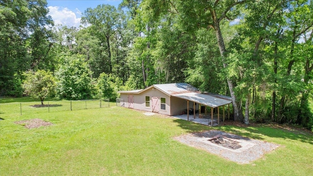 view of yard with a patio area and a fire pit