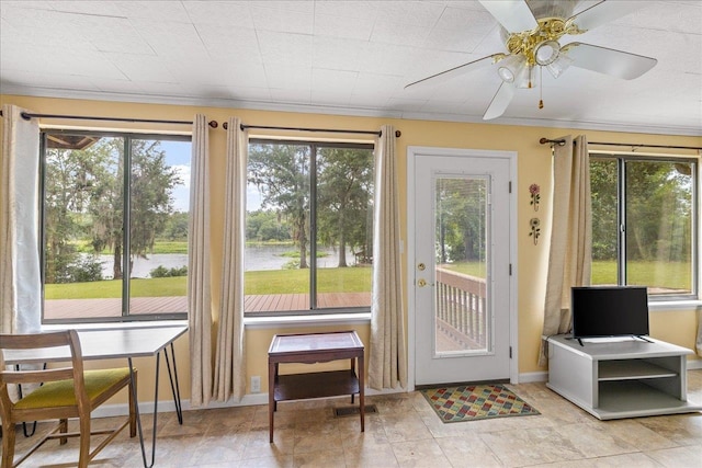doorway featuring ceiling fan, light tile patterned floors, a water view, and crown molding