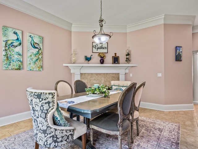 dining area featuring a fireplace, light tile patterned floors, and crown molding